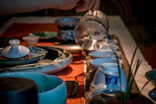 Traditional chinese tea making in dark with soft focus