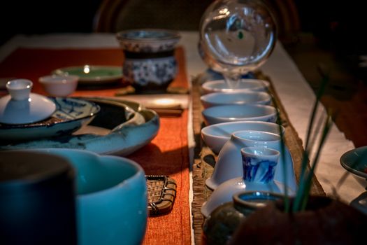 Traditional chinese tea making in dark with soft focus