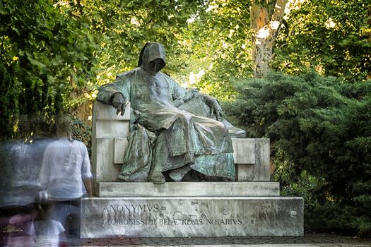  the Statue of Anonymous is in front of the Vajdahunyad Castle in the City Park, Budapest.