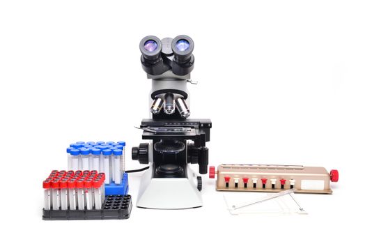 microscope with laboratory equipment on white background