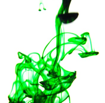 Vegetable ink poured into water with white background.