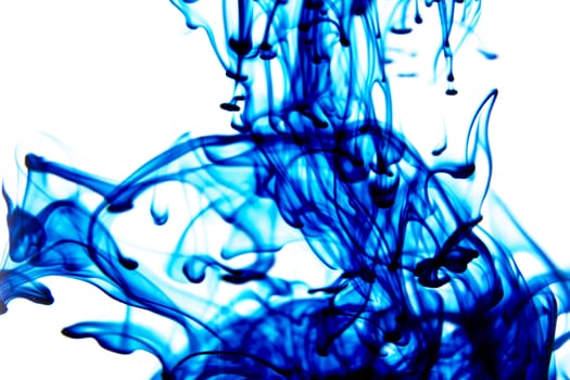Vegetable ink poured into water with white background.