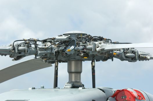 Rotor head of 4-bladed, large military helicopter