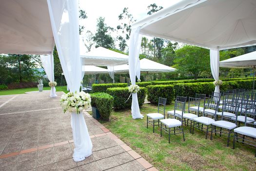 wedding marquee with bouquets of roses