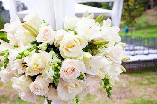 wedding marquee with bouquets of roses