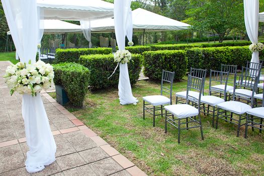 wedding marquee with bouquets of roses