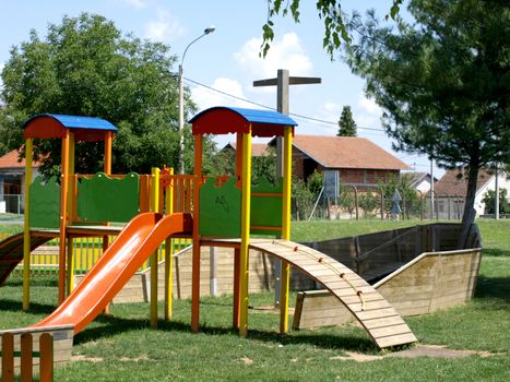 cheerful children's playground is located in a wooden board            