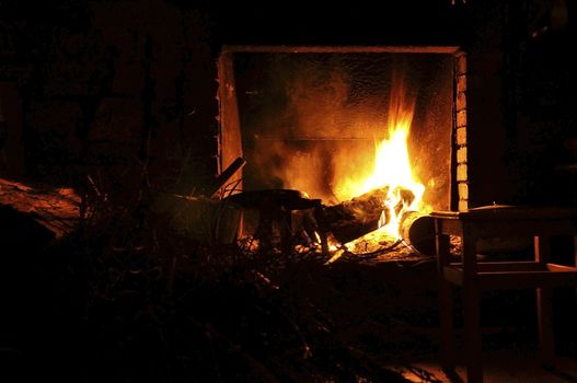 Coziness by the fireplace on a winter cabin