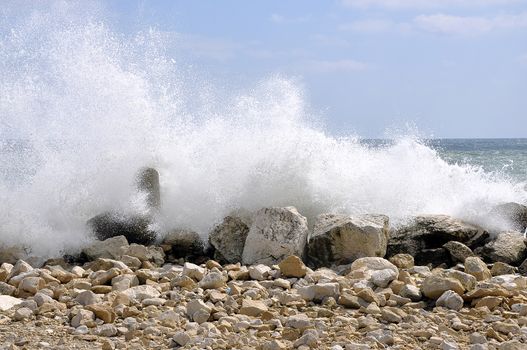 The waves on the Black Sea coast turn inward stone breakwater in Varna 