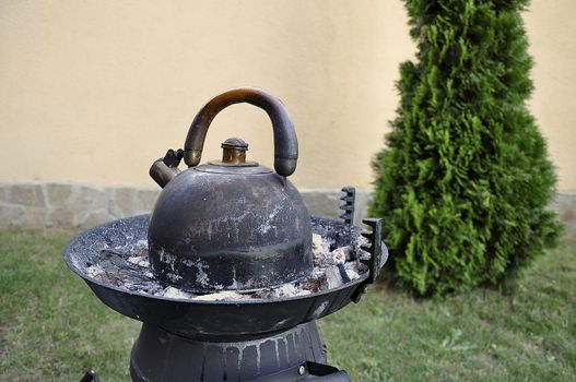 Coffee Cooking on a dying grill when the meal is consumed