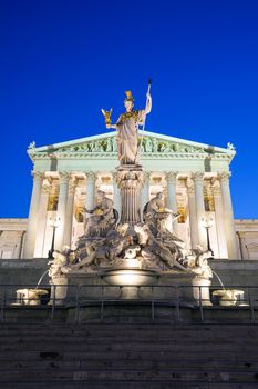 VIENNA, AUSTRIA - AUGUST 4, 2013: Austrian Parliament Building and The Athena Fountain at night.