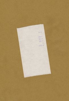 bill or receipt isolated over light brown background