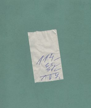 handwritten bill or receipt isolated over green blue background