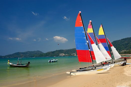 sail boat on patong beach, phuket, thailand