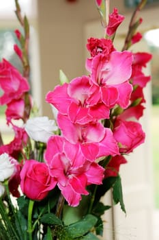 Closeup detail of red floral decoration at wedding ceremony