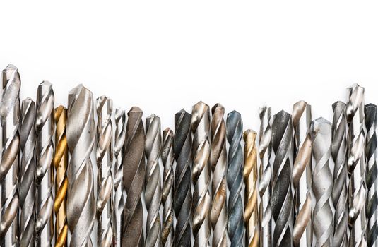 Various used twist drill bits in a row