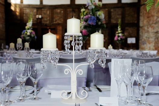Wedding reception table showing decoration of candles and flowers