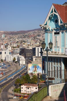 Colourfully painted house on a lookout in the hills above the harbour in the UNESCO World Heritage City of Valparaiso in Chile.