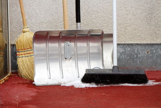 Close up on winter tools as shovel and broom to remove snow