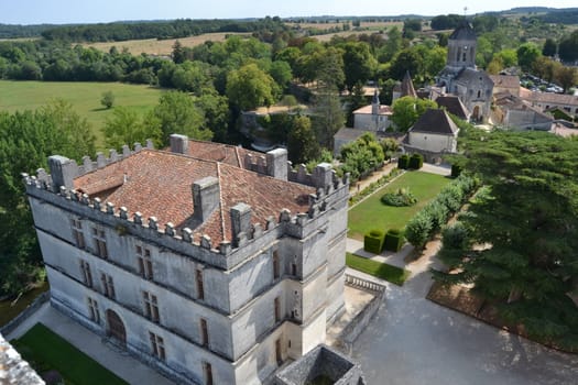 Renaissance Bourdeilles castle and garden from the keep of the medieval castle. Sunny day in summer