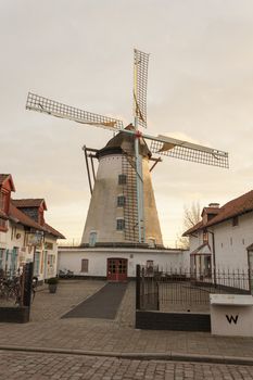 Vintage stone windmill in flanders belgium