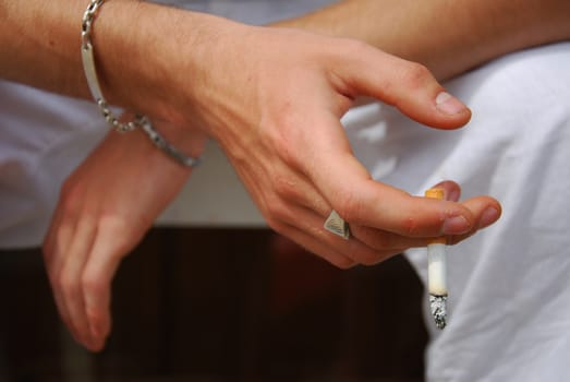 smoker hand closeup with cigarette