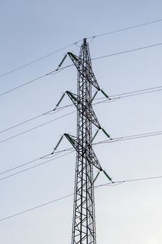 Electricity pylon high in blue sky tower energy