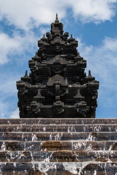 Details of hindu temple india with water flowing from the steps of the stair