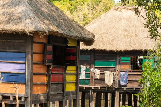 Colorful Stilt village in africa Floating  with laundry.