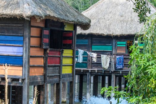 Colorful Stilt village in africa Floating  with laundry.