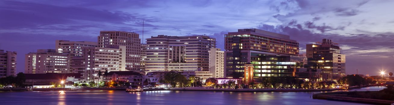 panorama Siriraj hospital.Atmosphere after the sun sets in the evening. Light on the building at night.