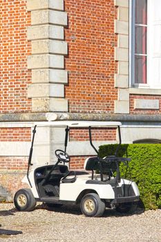 Golf cart parked near Golf club at Saint Saens, France