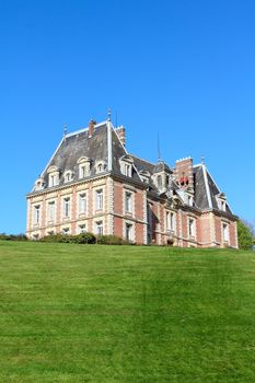 View on beautiful landscape with old mansion at Saint Saens, France