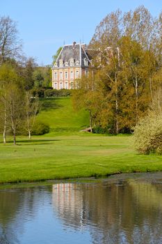 View on beautiful landscape with old mansion at Saint Saens, France