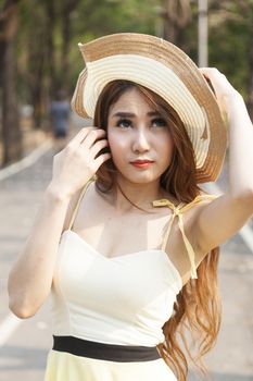 Portrait Asian woman wearing hat Within the park