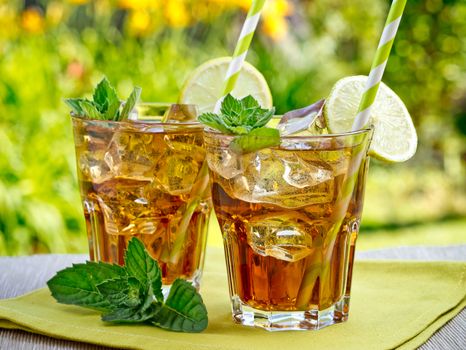 Refreshing peach, lime and mint ice tea served outdoors