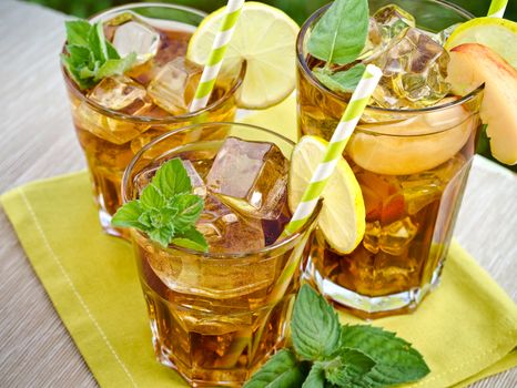 Refreshing peach, lime and mint ice tea served outdoors