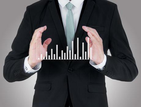 Businessman standing posture hand holding graph finance isolated on over gray background