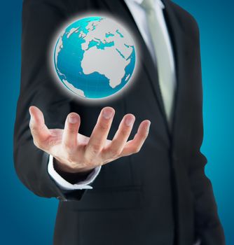 Businessman standing posture hand holding Earth icon isolated on over blue background