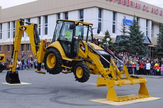 City Day of Tyumen, on July 26, 2014, show of dancing excavators