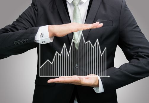 Businessman standing posture hand holding graph finance isolated on over gray background