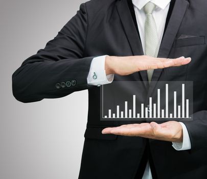 Businessman standing posture hand holding graph finance isolated on over gray background
