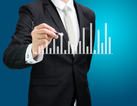 Businessman hand drawing a graph Isolated on blue background