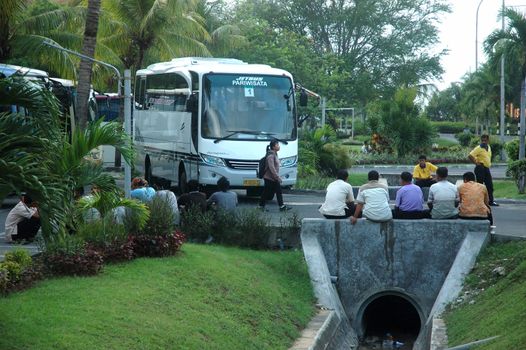 bali, indonesia-november 23, 2012: parking bus area at ngurah rai international airport, bali-indonesia.