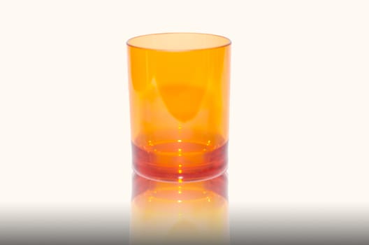 Orange plastic cups isolated on white background.