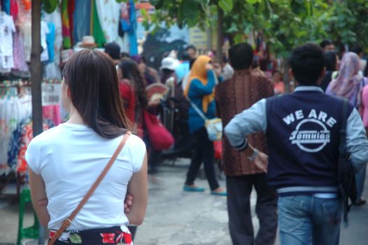 bali, indonesia-november 24, 2012: tourists at tanah lot temple beraban, bali-indonesia.