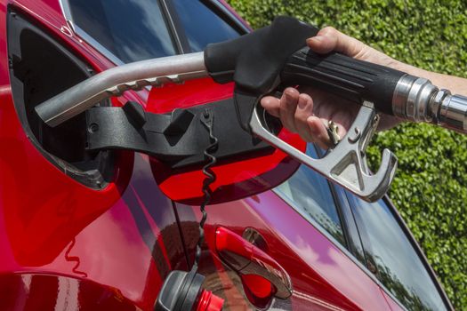 Pumping Gas - Filling a cars fuel tank with diesel. 