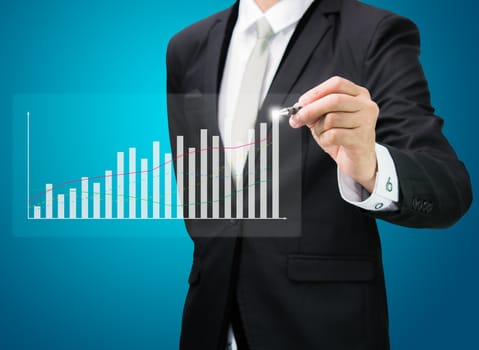 Businessman hand drawing a graph Isolated on blue background