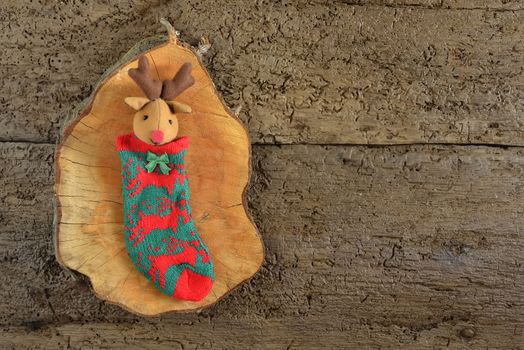 Rustic christmas background with copy space, reindeer sock