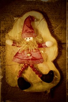 Elf Santa Christmas decoration on old wooden background